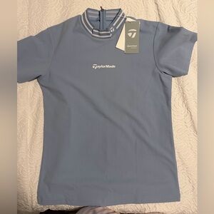 The TaylorMade TL801 women's short-sleeve mock neck golf shirt